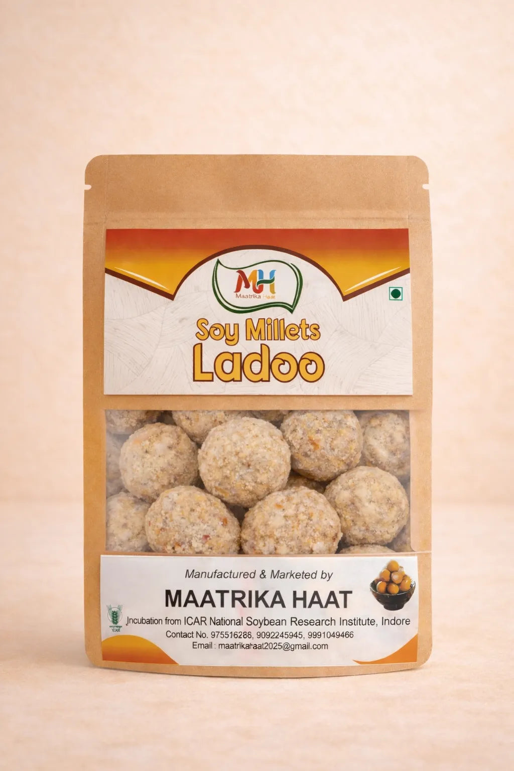 Packaging of Soy Millets Ladoo with brand logo on a beige background